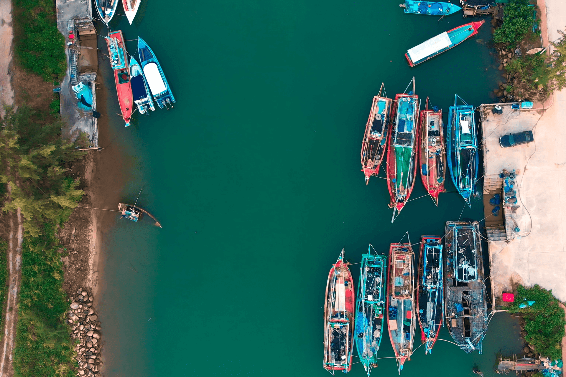 Fishing boats moored along a waterfront