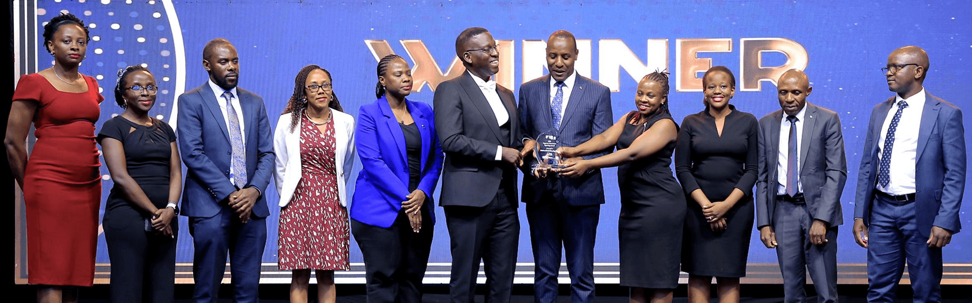 NSSF staff led by Chief Financial Officer Stevens Mwanje receive the Governance Reporting Award at the 2025 FiRe Awards in Kampala