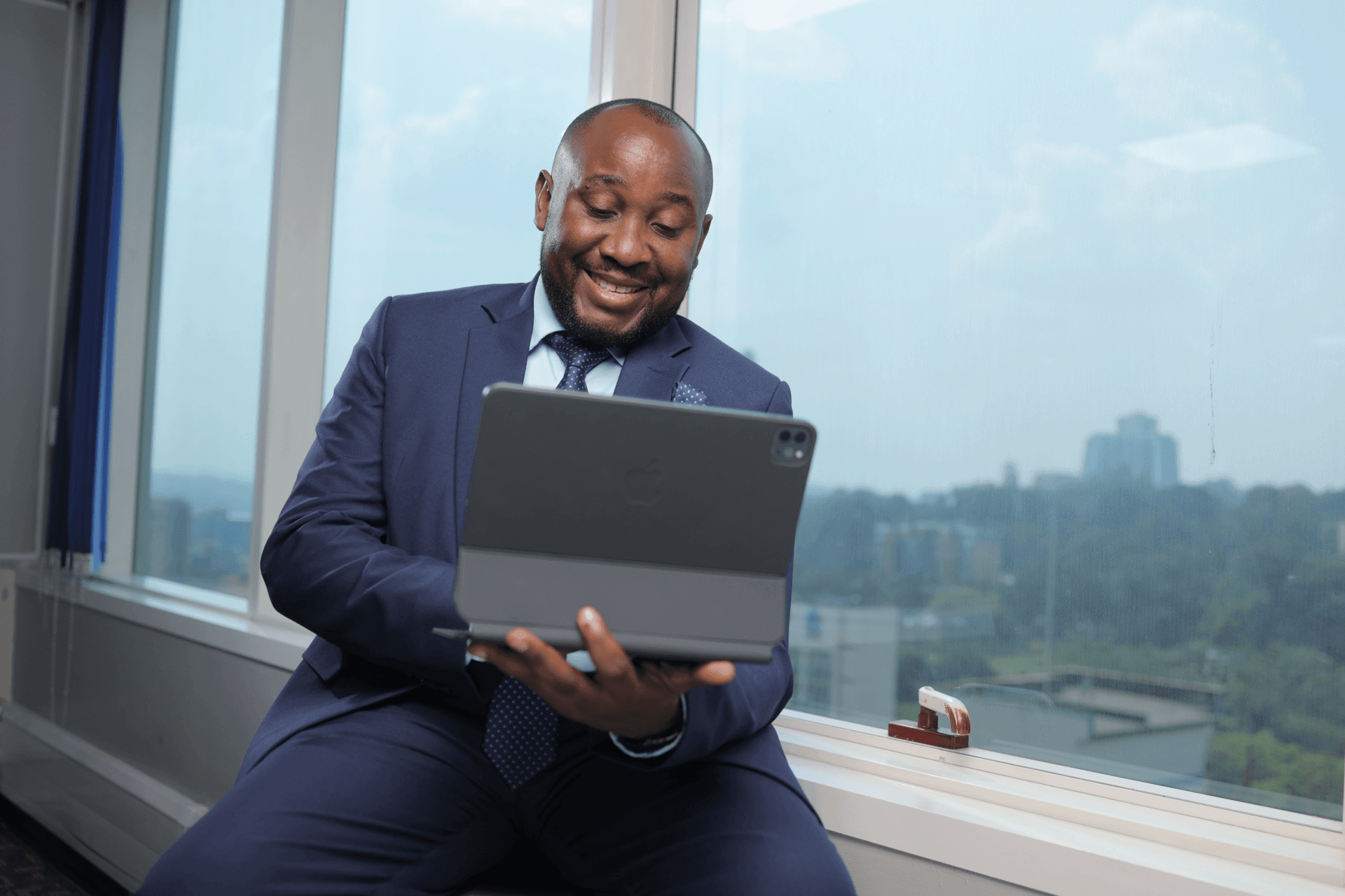 Man reviewing a tablet in an office