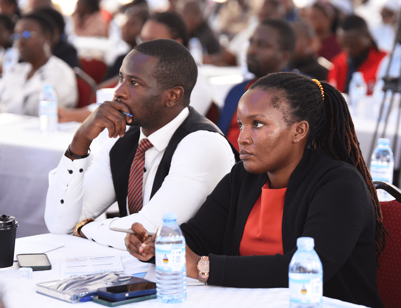 Delegates listening at a conference