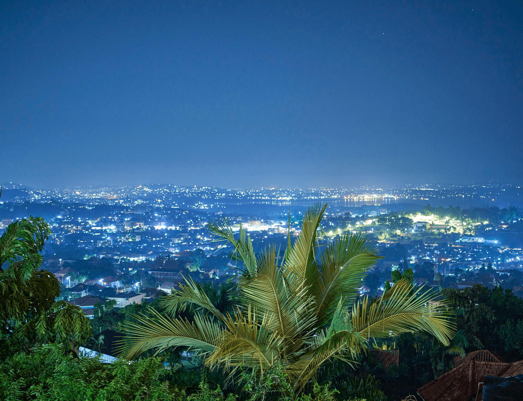 City lights across a hillside at dusk