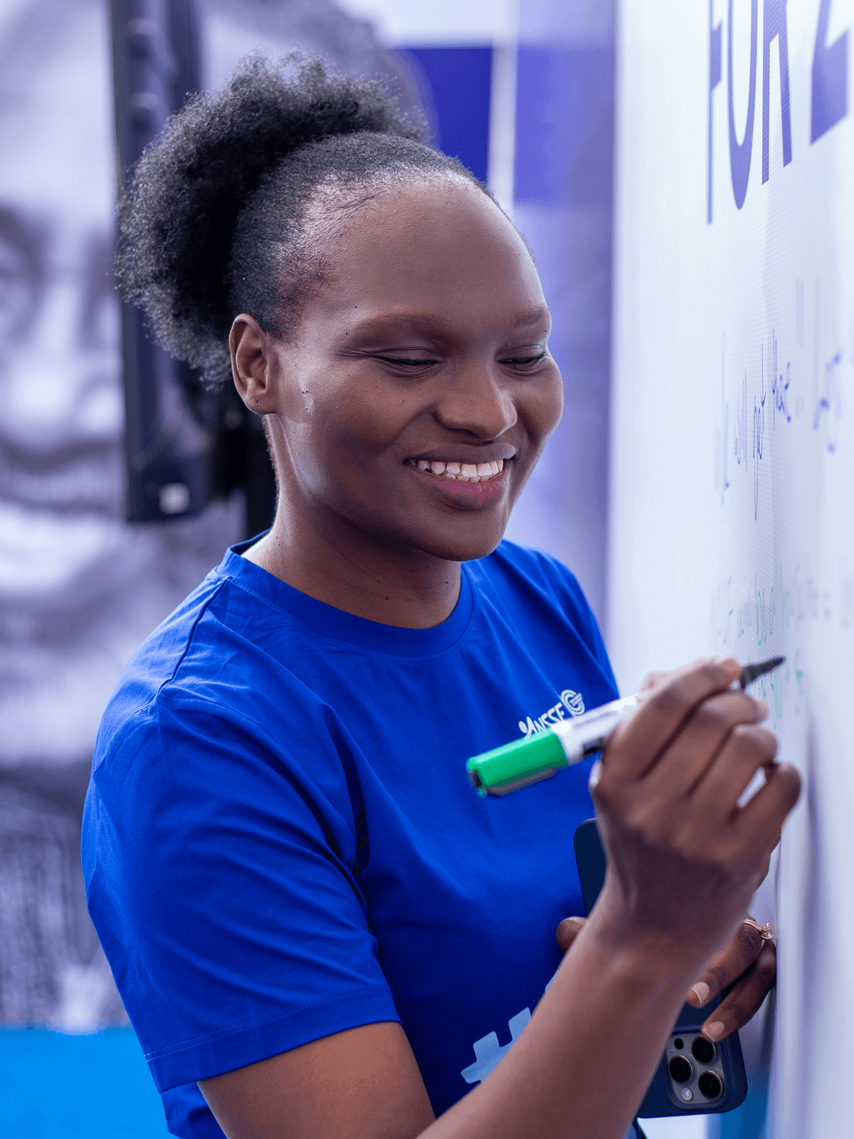 NSSF Chief Marketing and Corporate Affairs Officer signing the new values pledge