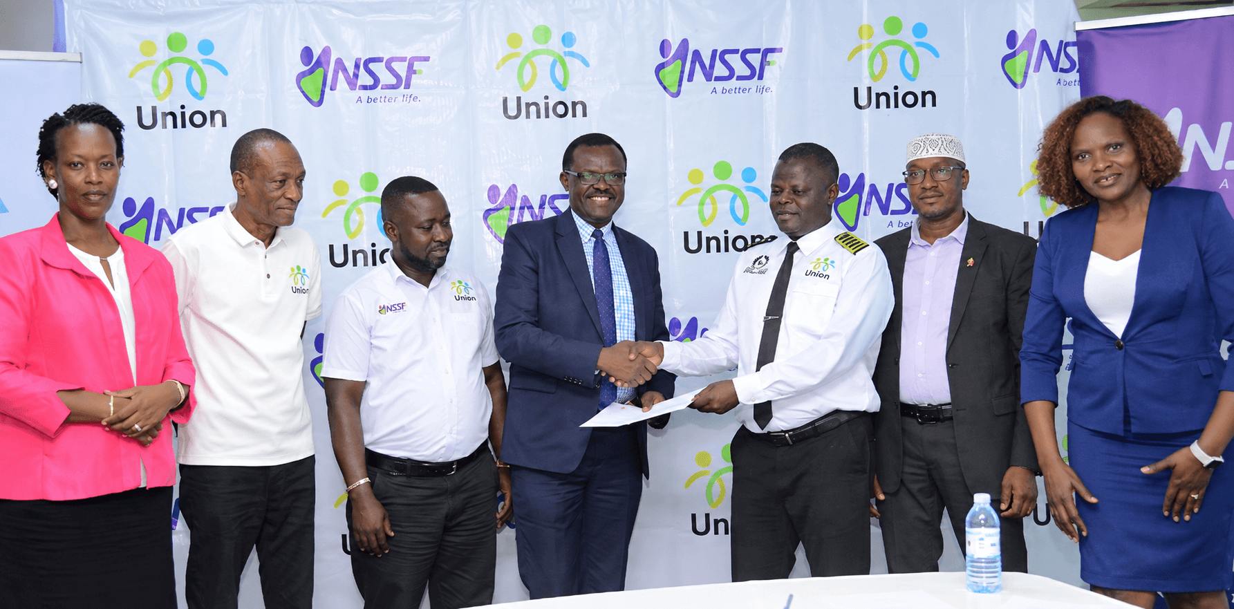 NSSF, led by Managing Director Patrick Ayota (centre-left), partnered with the Boda Boda unions, led by their Chairperson (centre-right), to promote Smartlife Flexi among informal-sector workers.