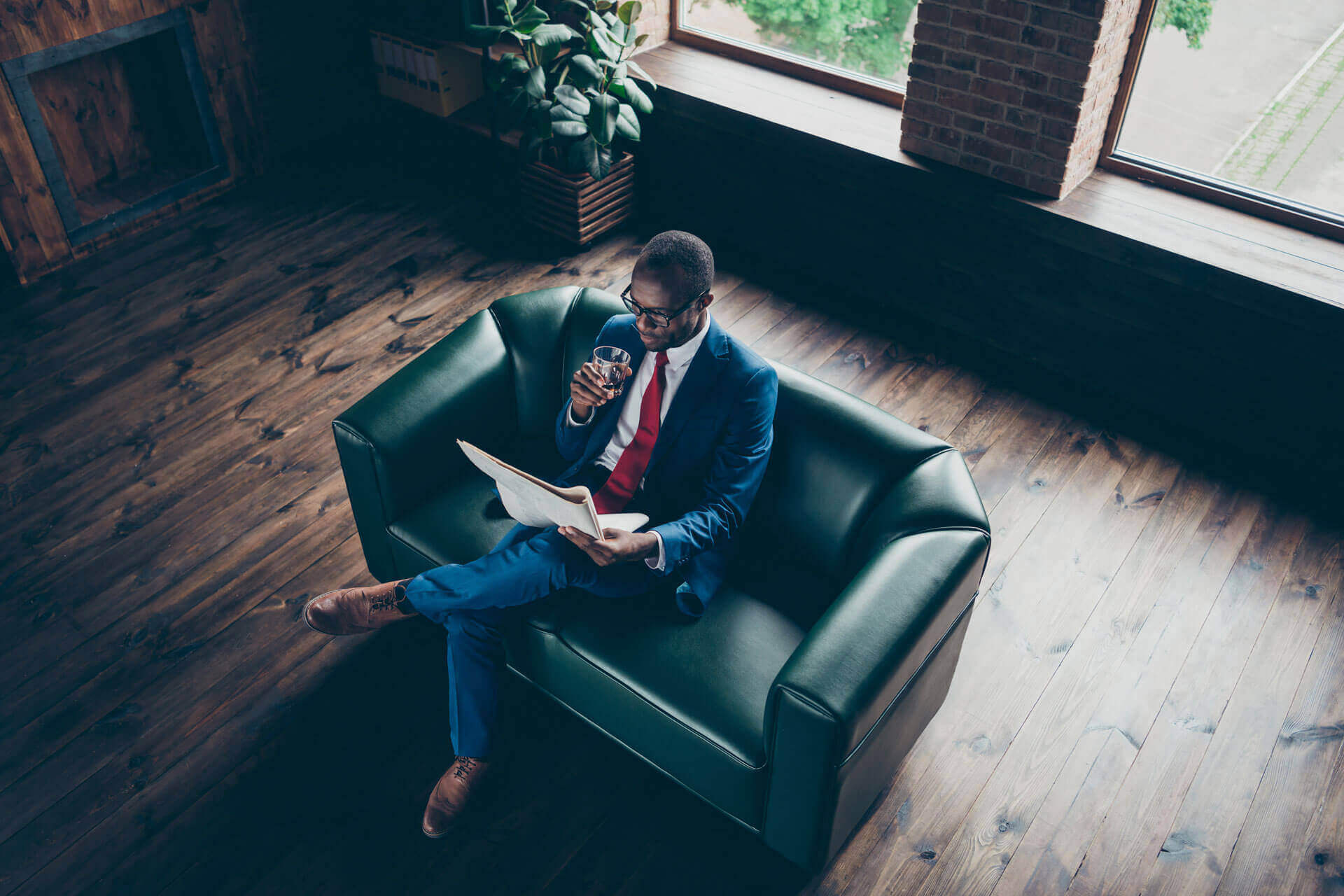 A business professional reading in an office
