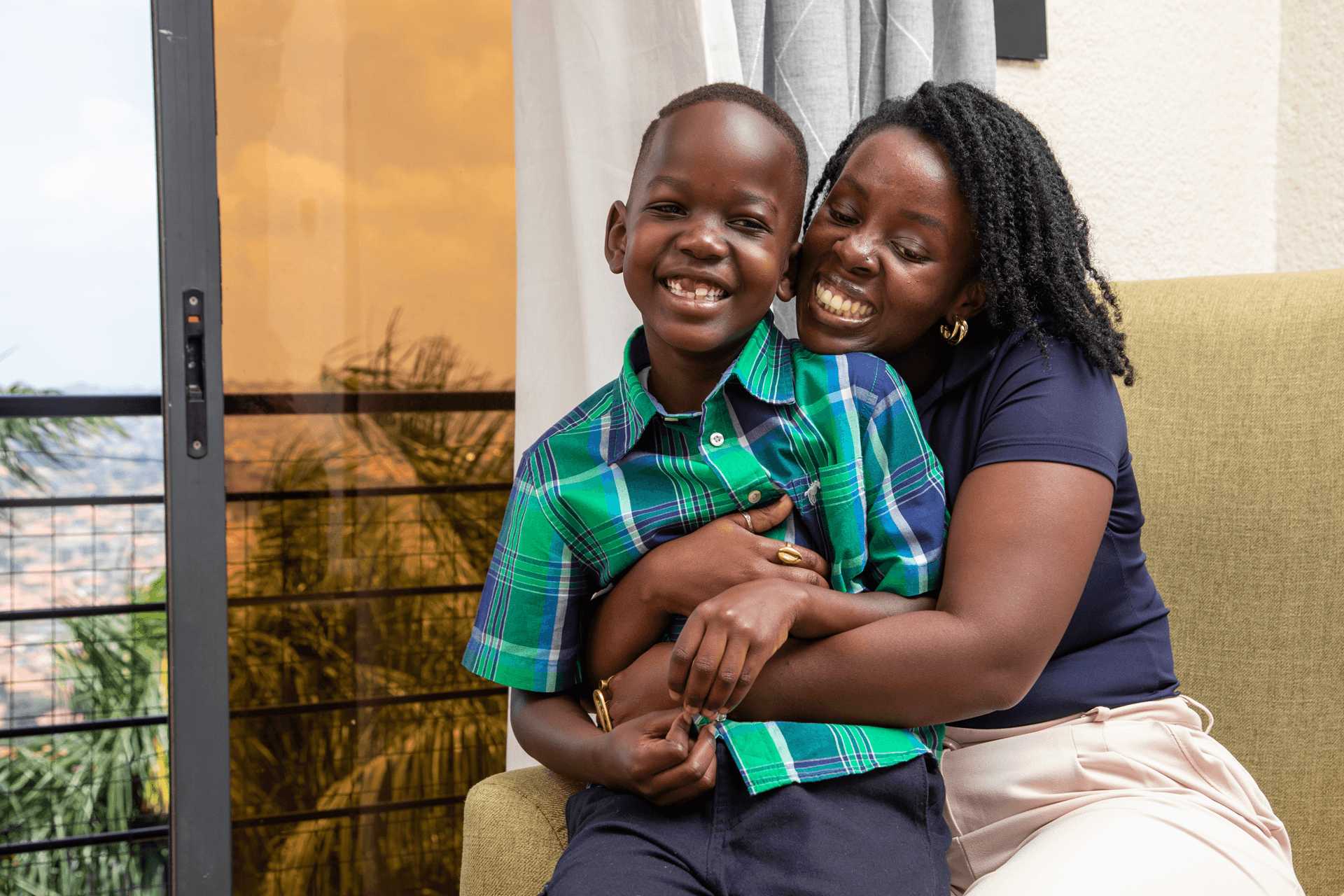 Woman embracing a smiling child